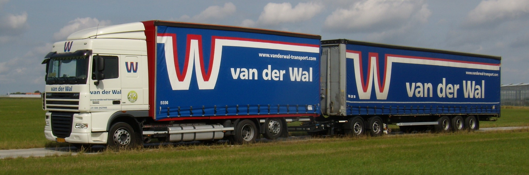 Van der Wal long-combination vehicle: a truck pulling two curtain-side trailers